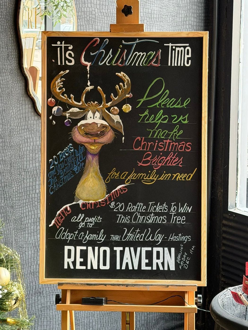 Hand-drawn reindeer chalkboard for the Christmas tree raffle